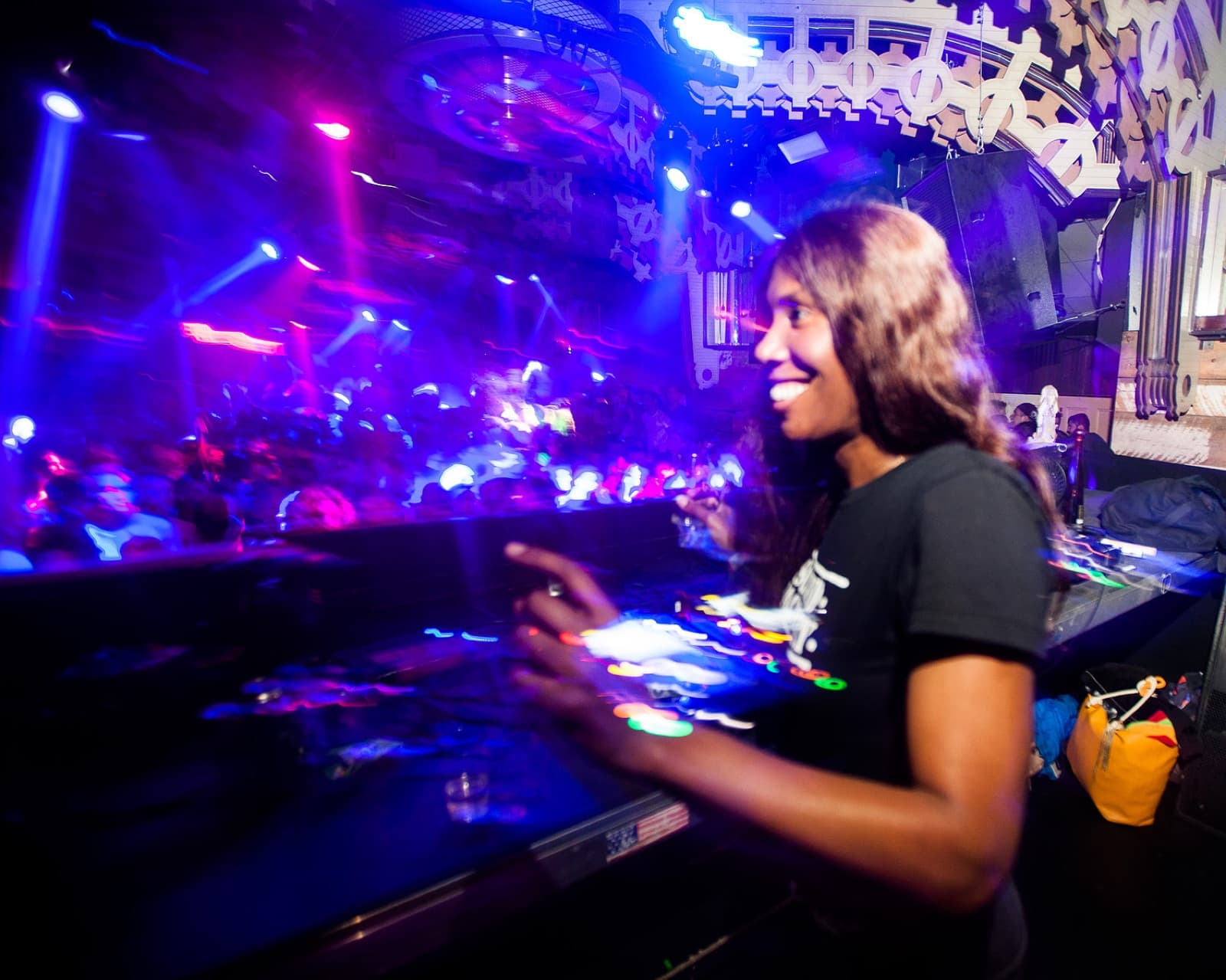 DJ smiling over the decks at Battle Hymn, New York