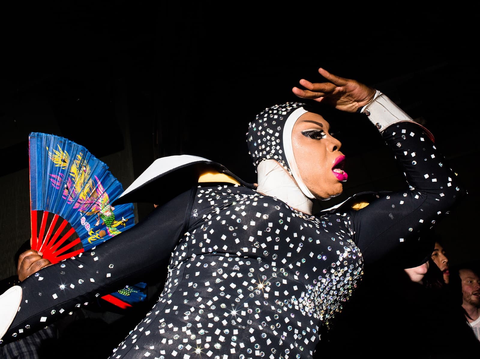 Performer voguing with a folding fan at Battle Hymn, New York