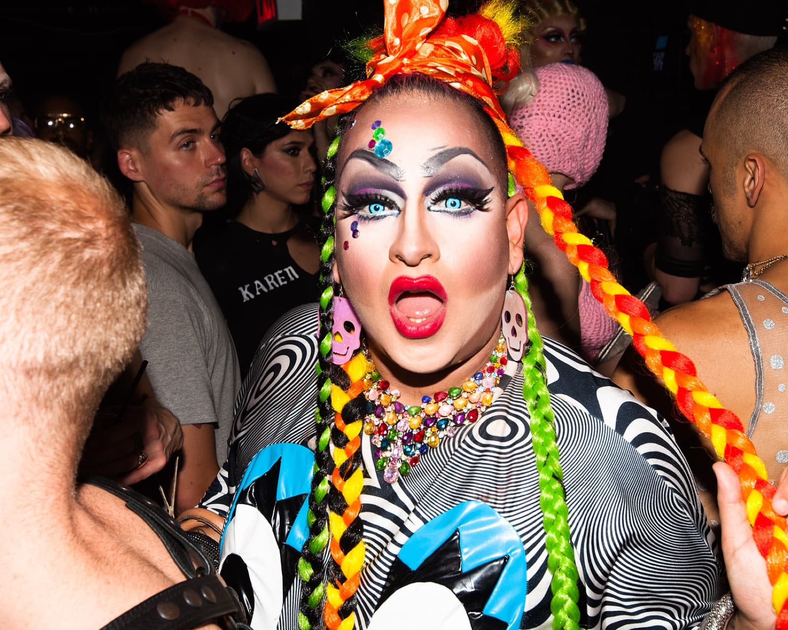 Queen in rainbow braids in the crowd at Holy Mountain, New York